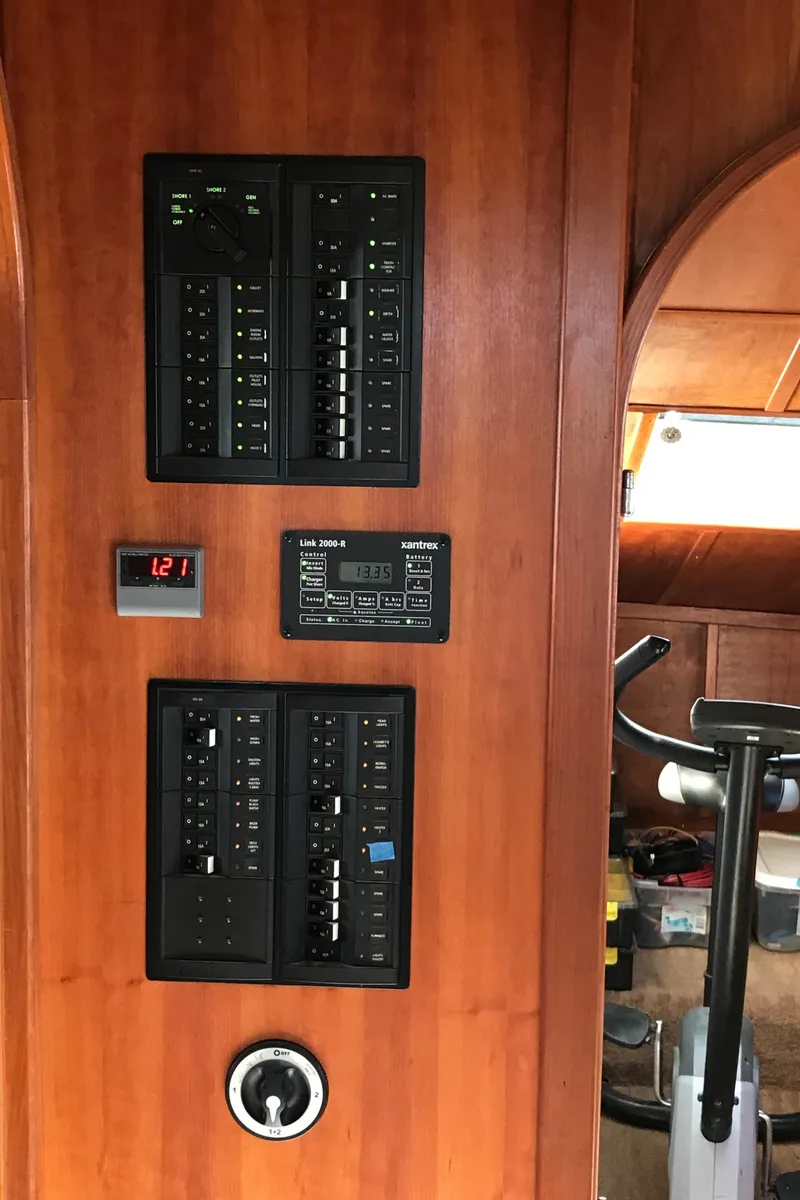 Slide: The Image of Electrical panel on 2008 Custom 62 Catamaran with wooden interior. - 10