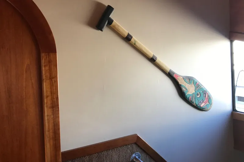 Slide: The Image of Decorative paddle on wall inside 2008 Custom 62 Catamaran, featuring colorful design. - 13