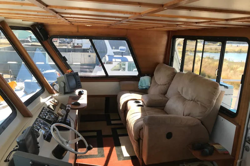 Slide: The Image of Interior of 2008 Custom 62 Catamaran with plush seating and navigation controls. - 24