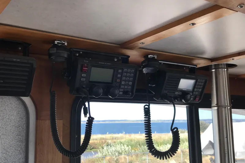 Slide: The Image of Radio equipment inside a 2008 Custom 62 Catamaran with ocean view through windows. - 30