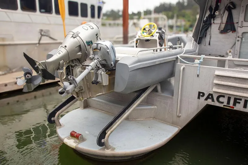 Slide: The Image of Custom 62 Catamaran 2008 with outboard motor at dock, rear view. - 39