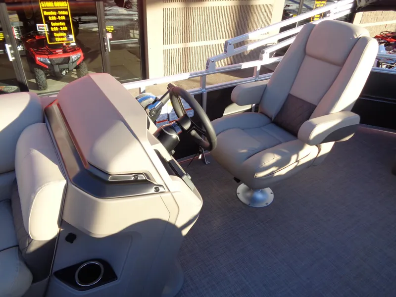 Slide: The Image of 2024 Sun Tracker Party Barge 20 DLX pontoon boat captain's chair and helm station. - 11