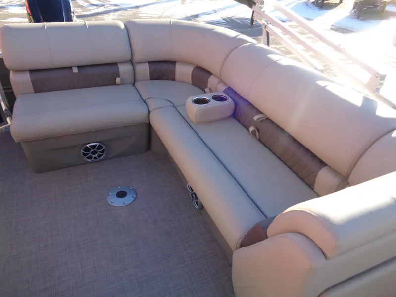 Slide: The Image of 2024 Sun Tracker Party Barge 20 DLX pontoon boat with beige seating and cup holders. - 13