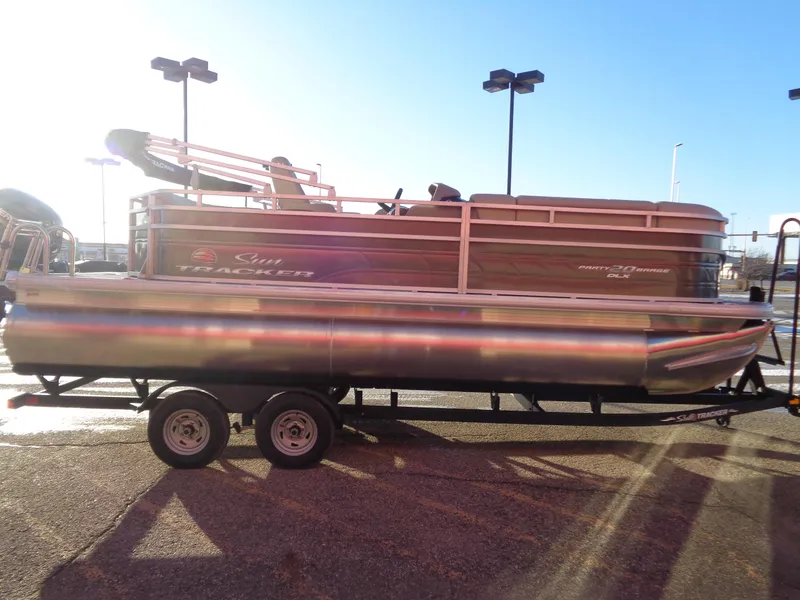 Slide: The Image of 2024 Sun Tracker Party Barge 20 DLX pontoon boat on trailer. - 4