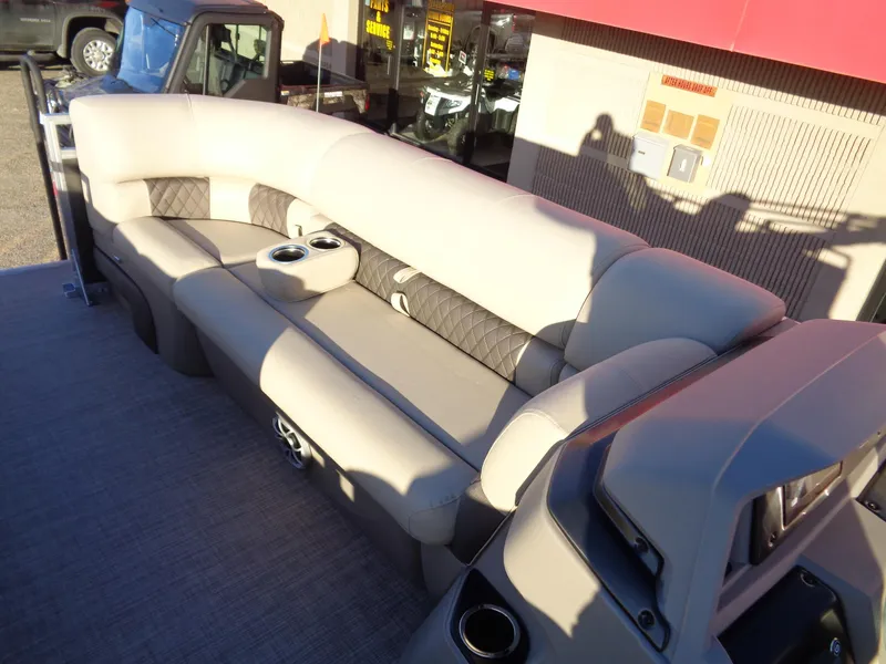 Slide: The Image of 2024 Sun Tracker Party Barge 20 DLX pontoon boat interior with plush seating. - 8