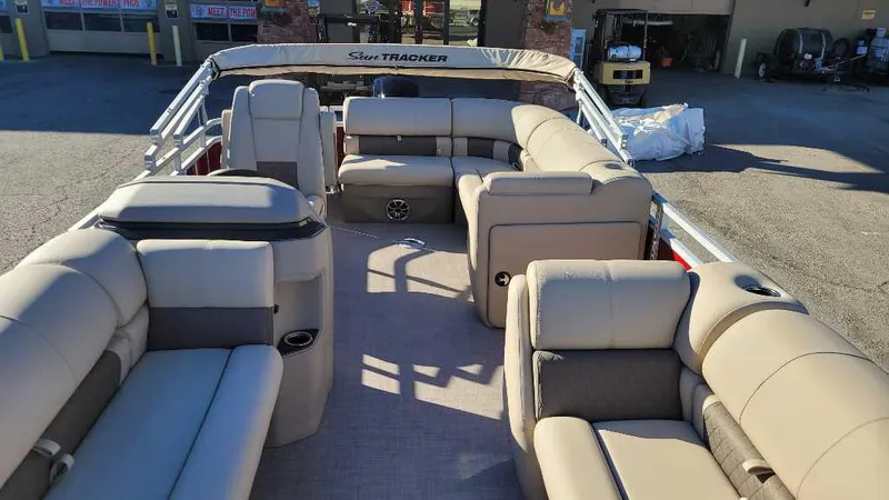 Slide: The Image of 2024 Sun Tracker Party Barge 20 DLX with spacious seating and modern design. - 2
