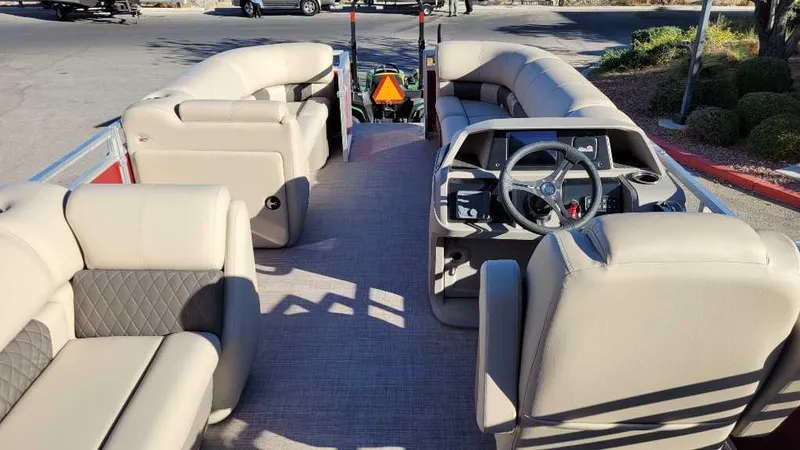 Slide: The Image of 2024 Sun Tracker Party Barge 20 DLX with spacious seating and modern helm. - 6