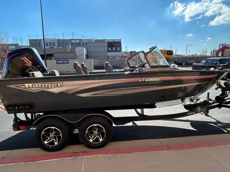 Slide: The Image of 2024 Ranger VX1888 WT fishing boat on trailer, parked outdoors. - 1