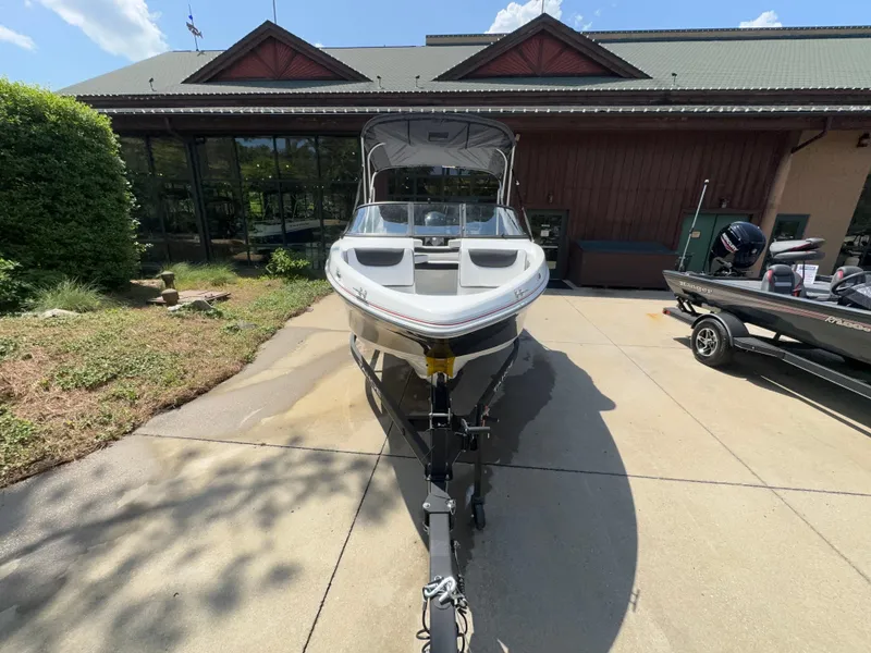 Slide: The Image of 2024 Tahoe 200 S boat parked on driveway in front of building. - 5