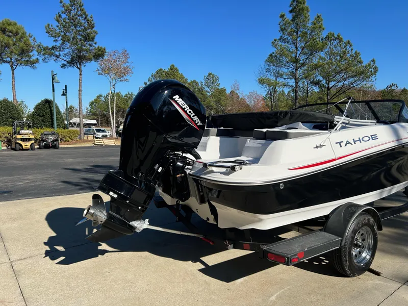 Slide: The Image of 2024 Tahoe 200 S boat with Mercury outboard motor on trailer. - 9