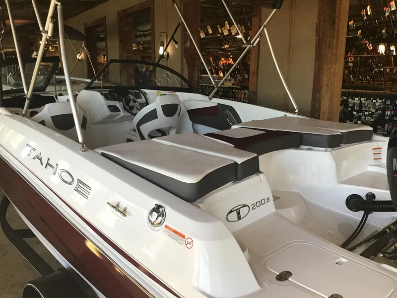 Slide: The Image of 2024 Tahoe 200 S boat interior with seating and steering wheel. - 37