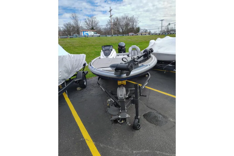 Slide: The Image of 2024 Nitro Z20 boat on trailer in parking lot, ready for transport. - 7