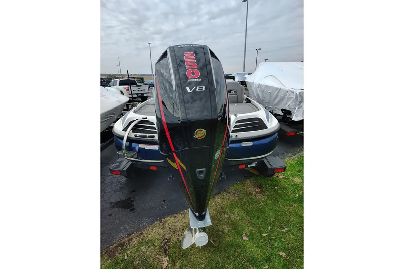 Slide: The Image of 2024 Nitro Z20 boat with powerful V8 engine, parked outdoors. - 8