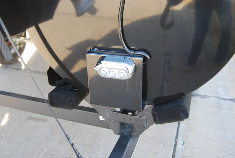 Slide: The Image of Close-up of 2024 Regency 230 LE3 trailer hitch and wiring. - 11