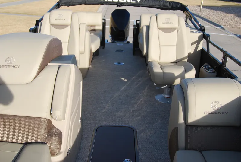 Slide: The Image of 2024 Regency 230 LE3 boat interior with beige seating and modern design. - 8