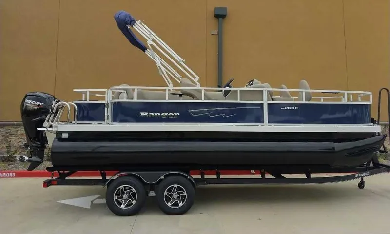 Slide: The Image of 2024 Ranger Reata 200F pontoon boat on a trailer. - 4