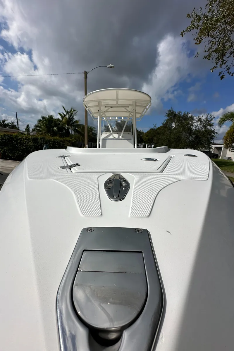 Slide: The Image of 2002 Jupiter 27 Open Fisherman boat, bow view under cloudy sky. - 13
