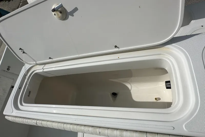 Slide: The Image of Open storage compartment on a 2002 Jupiter 27 Open Fisherman boat. - 14