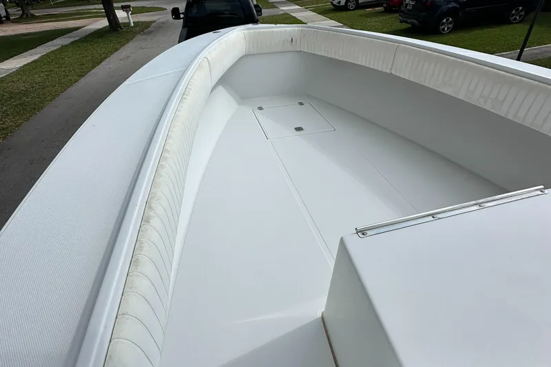 Slide: The Image of 2002 Jupiter 27 Open Fisherman boat with spacious deck and storage compartments. - 18