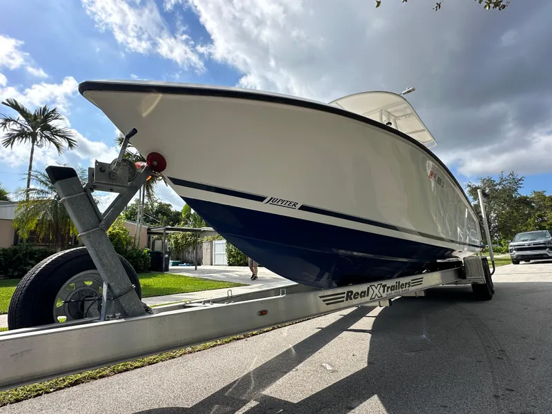 Slide: The Image of 2002 Jupiter 27 Open Fisherman boat on trailer, side view. - 4