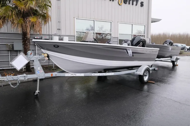 The Image of 2024 Crestliner 1600 Vision boat on trailer outside dealership. - 1