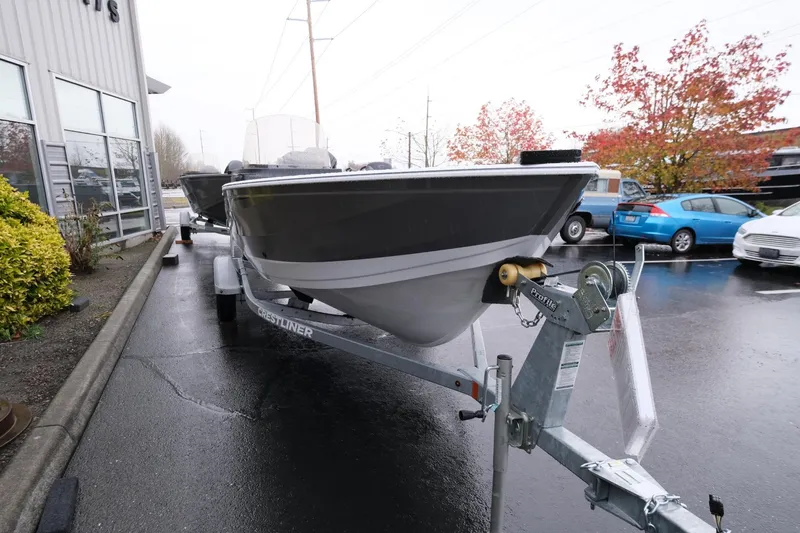 Slide: The Image of 2024 Crestliner 1600 Vision boat on trailer in parking lot. - 3