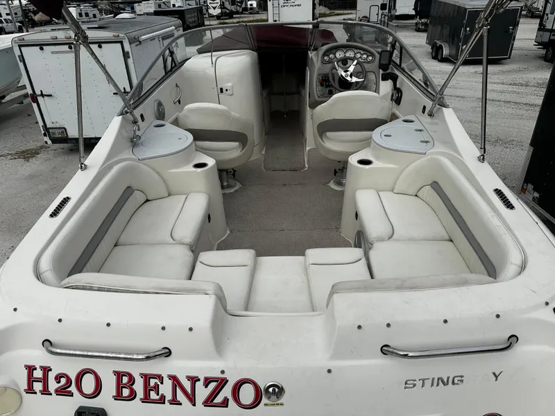Slide: The Image of 2011 Stingray 250 LR boat interior with seating and steering wheel. - 12