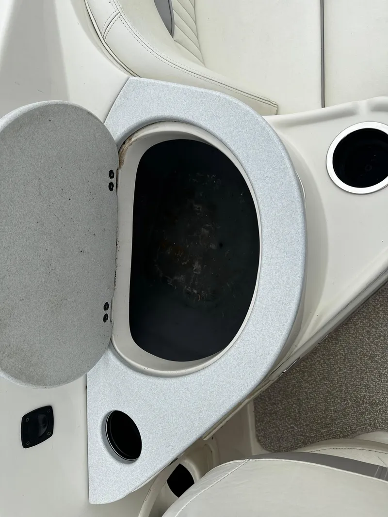 Slide: The Image of Open storage compartment in a 2011 Stingray 250 LR boat. - 30