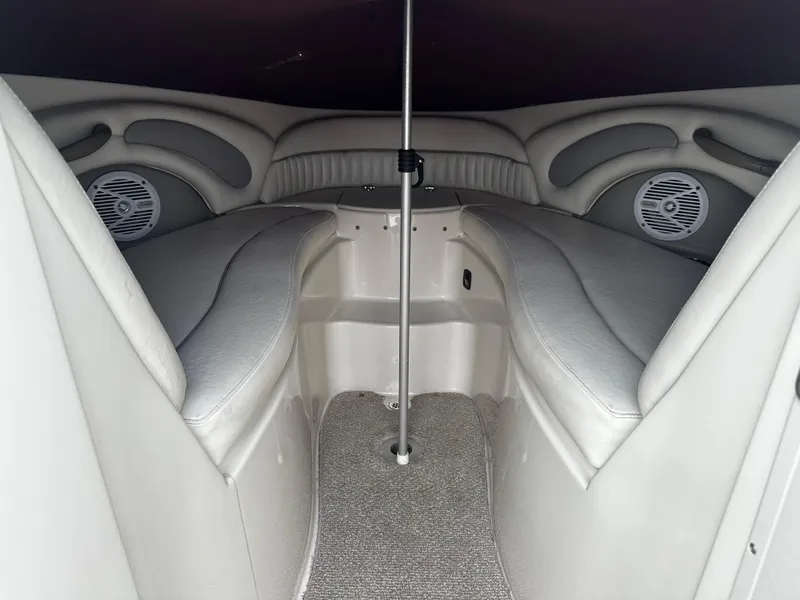 Slide: The Image of Interior cabin of a 2011 Stingray 250 LR boat with cushioned seating. - 31