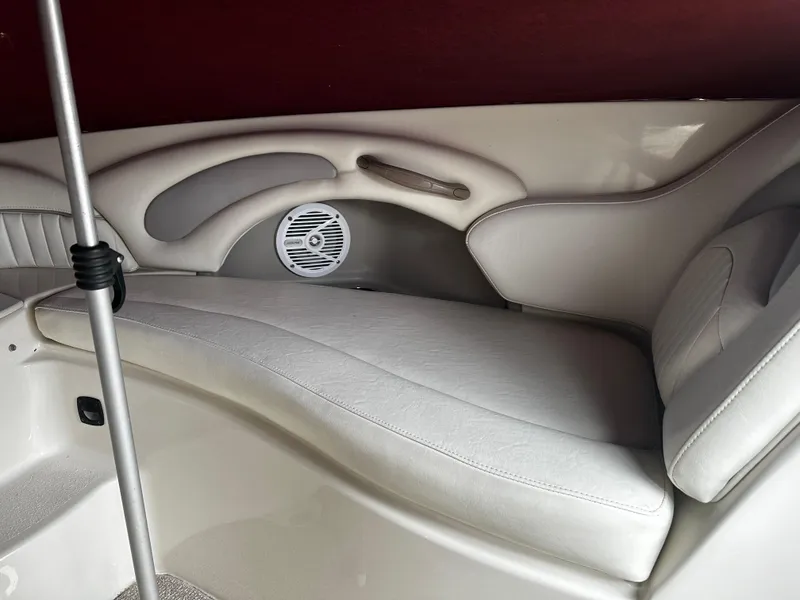 Slide: The Image of Interior seating of a 2011 Stingray 250 LR boat with white upholstery. - 32