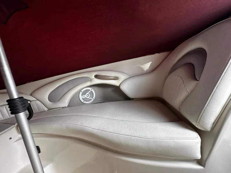 Slide: The Image of Interior seating of a 2011 Stingray 250 LR boat with white upholstery. - 34