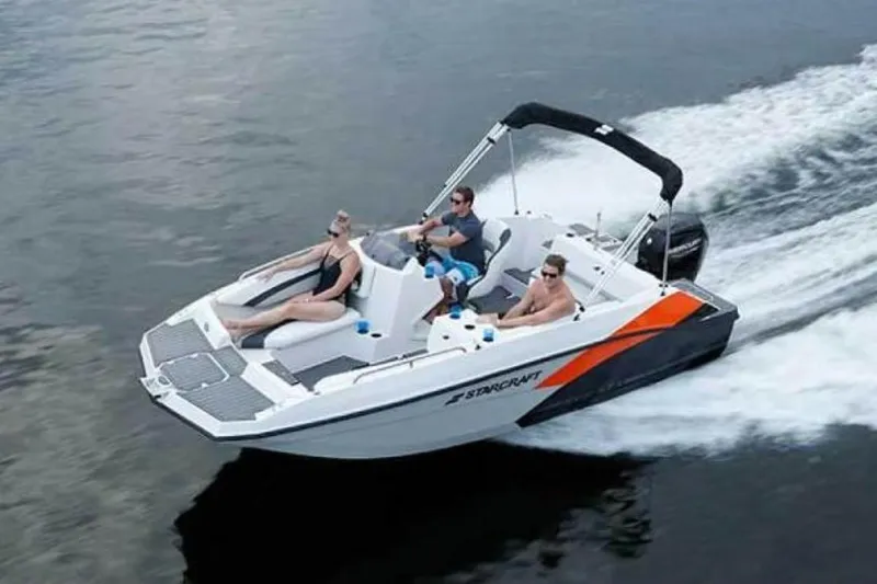 Slide: The Image of 2023 Starcraft SVX 171 OB boat cruising on water with passengers enjoying the ride. - 1