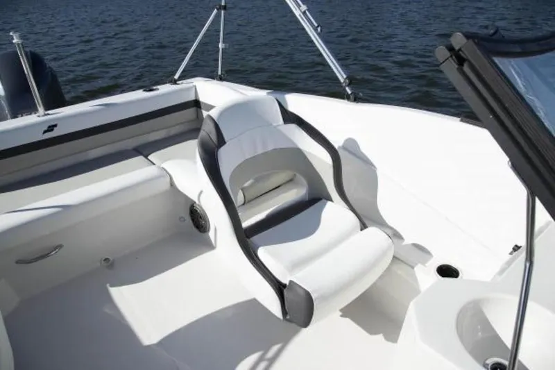 Slide: The Image of 2023 Starcraft SVX 171 OB boat interior with white seating and sleek design on water. - 10