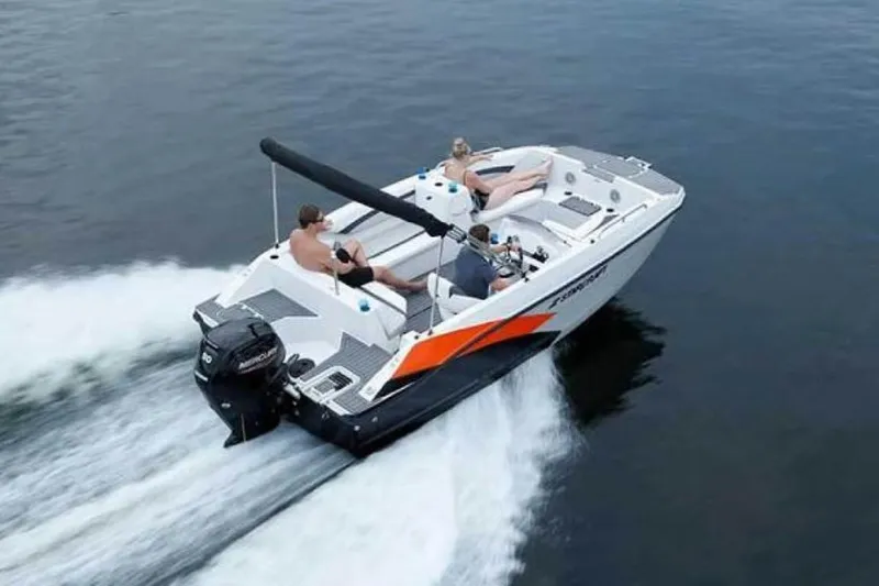 Slide: The Image of 2023 Starcraft SVX 171 OB boat cruising on water with passengers onboard. - 2