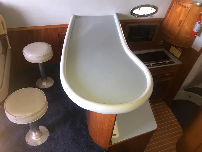 Slide: The Image of Interior of 1990 Mediterranean 38 Sport Fisher with bar and seating area. - 14
