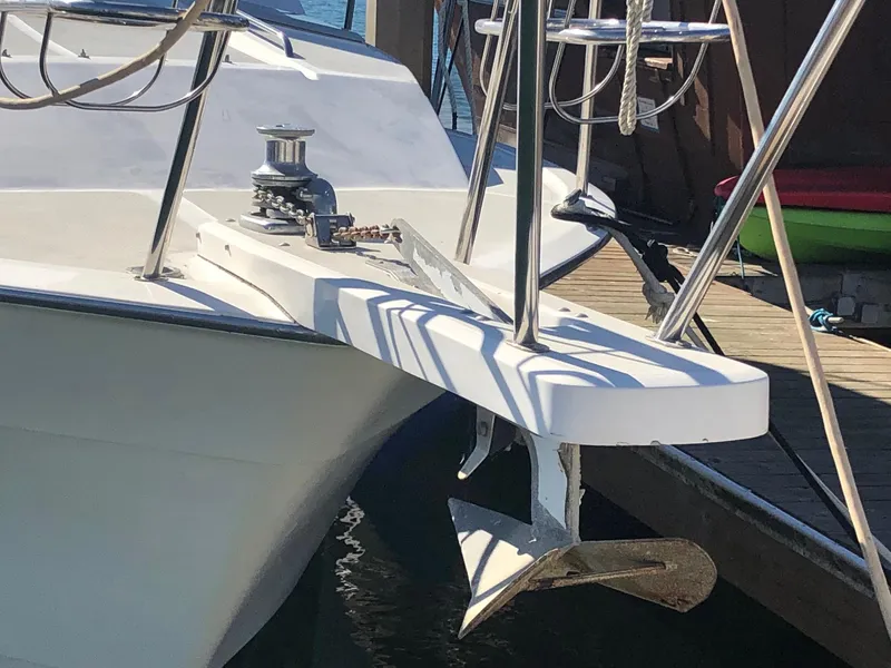 Slide: The Image of 1990 Mediterranean 38 Sport Fisher boat anchor and bow detail at dock. - 25