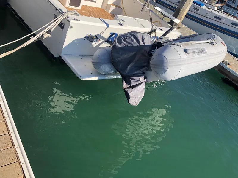 Slide: The Image of 1990 Mediterranean 38 Sport Fisher with dinghy at marina dock. - 26