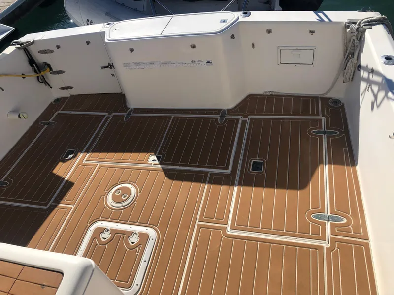 Slide: The Image of 1990 Mediterranean 38 Sport Fisher boat deck with teak flooring. - 33