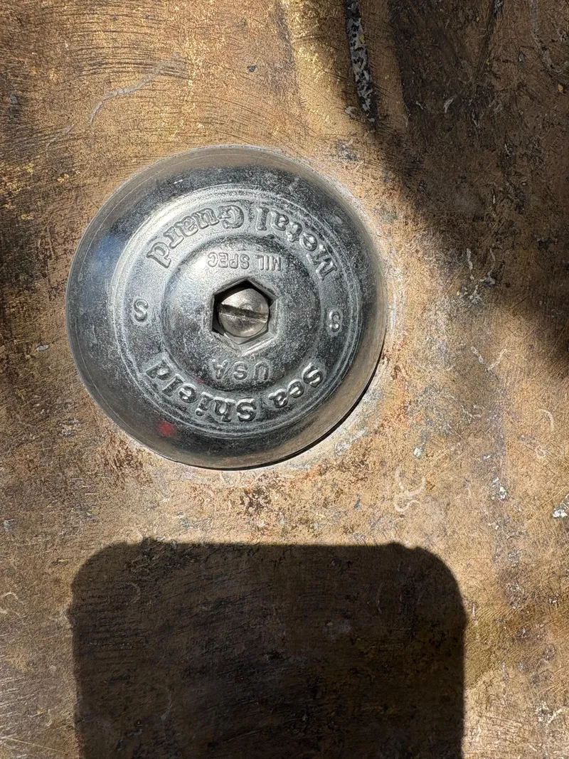 Slide: The Image of Close-up of a metallic fitting on a 1990 Mediterranean 38 Sport Fisher boat. - 36