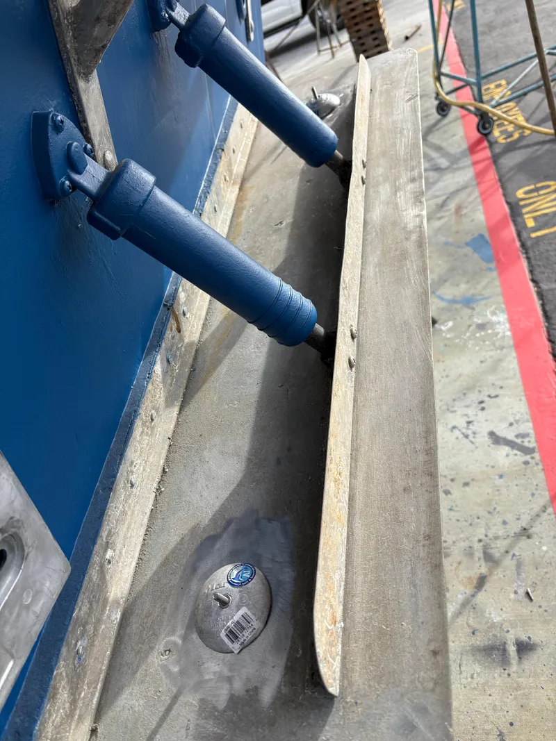 Slide: The Image of 1990 Mediterranean 38 Sport Fisher boat detail with trim tabs and zinc anode. - 39