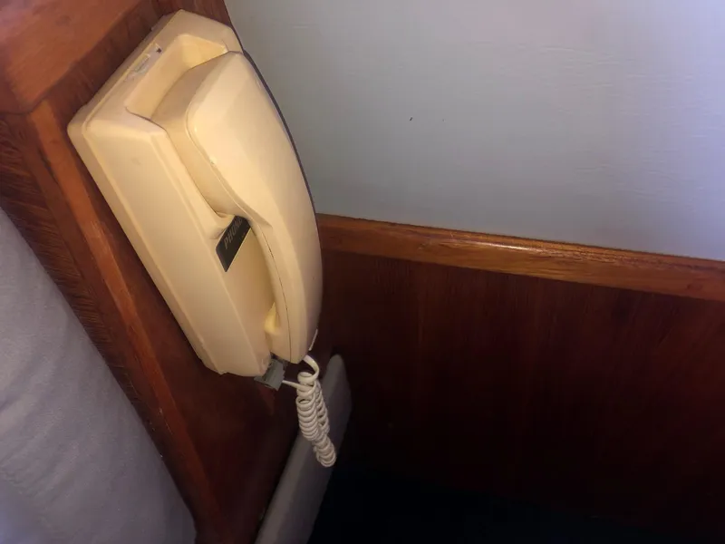 Slide: The Image of Wall-mounted vintage telephone on a Mediterranean 38 Sport Fisher yacht, 1990 model. - 8