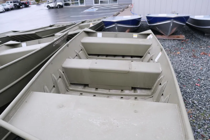 Slide: The Image of 2024 Crestliner 1448M CR Jon boat in a dealership lot. - 5