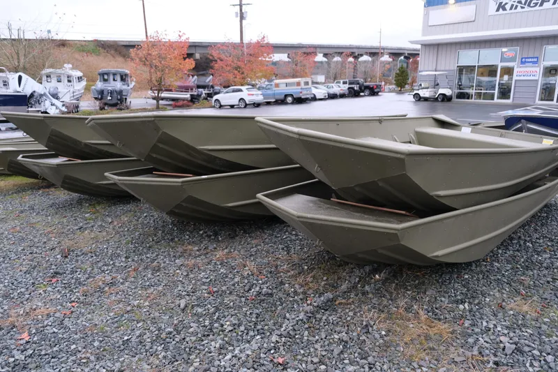 Slide: The Image of 2024 Crestliner 1448M CR Jon boats stacked at a dealership lot. - 7