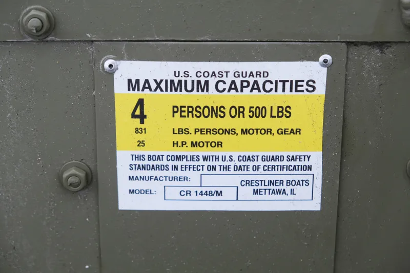 Slide: The Image of U.S. Coast Guard capacity label on 2024 Crestliner 1448M CR Jon boat. - 8