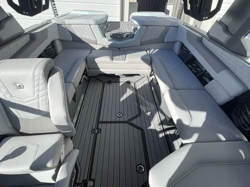 Slide: The Image of 2024 Nautique Super Air Nautique G23 interior with luxurious seating and modern design. - 7