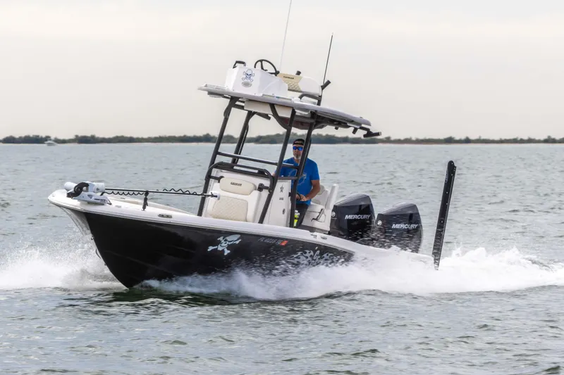 Slide: The Image of 2022 Caymas 281HB Center Console boat cruising on water. - 14