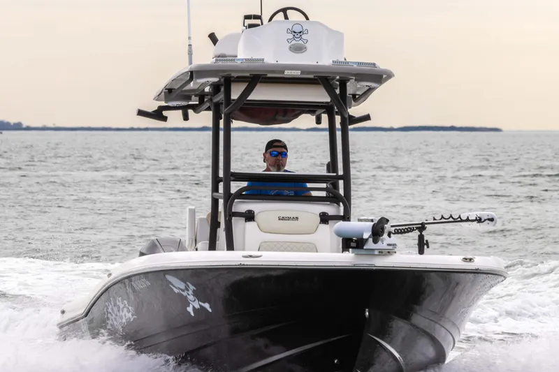 Slide: The Image of 2022 Caymas 281HB Center Console boat cruising on open water. - 18