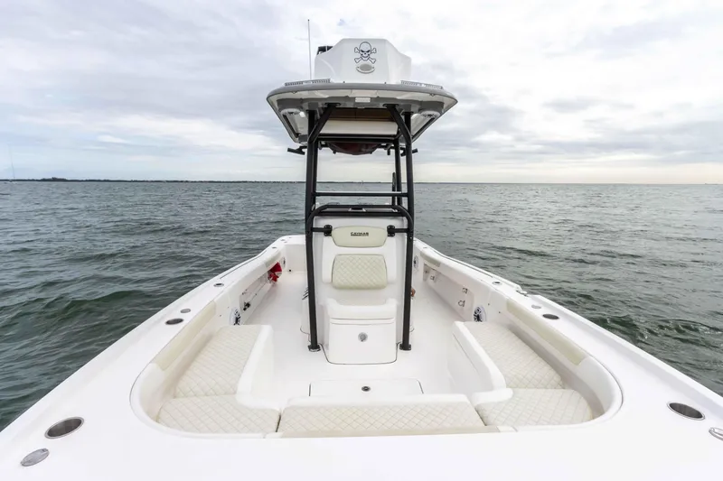 Slide: The Image of 2022 Caymas 281HB Center Console boat on open water. - 20