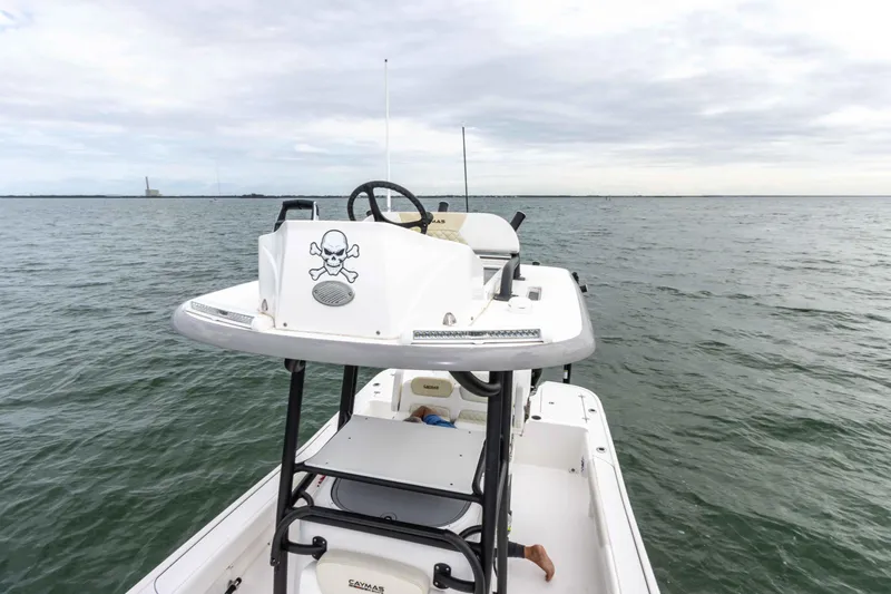 Slide: The Image of 2022 Caymas 281HB Center Console boat on open water. - 22