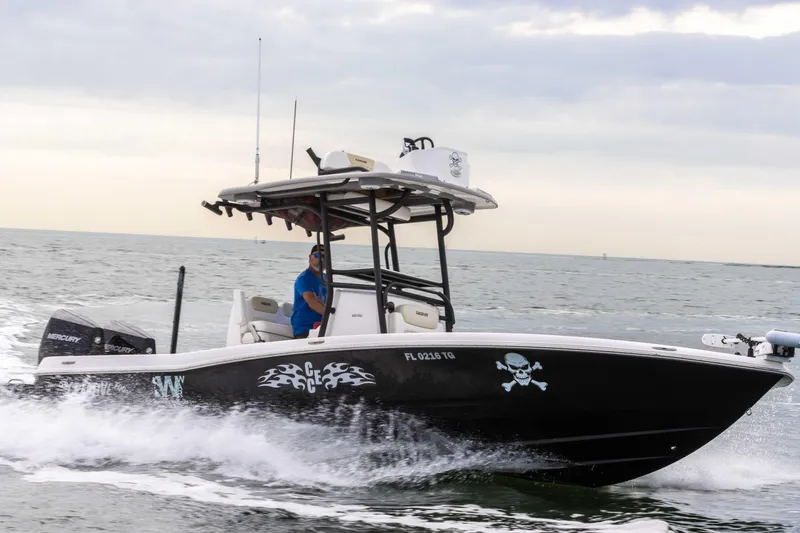 Slide: The Image of 2022 Caymas 281HB Center Console boat cruising on the ocean. - 29